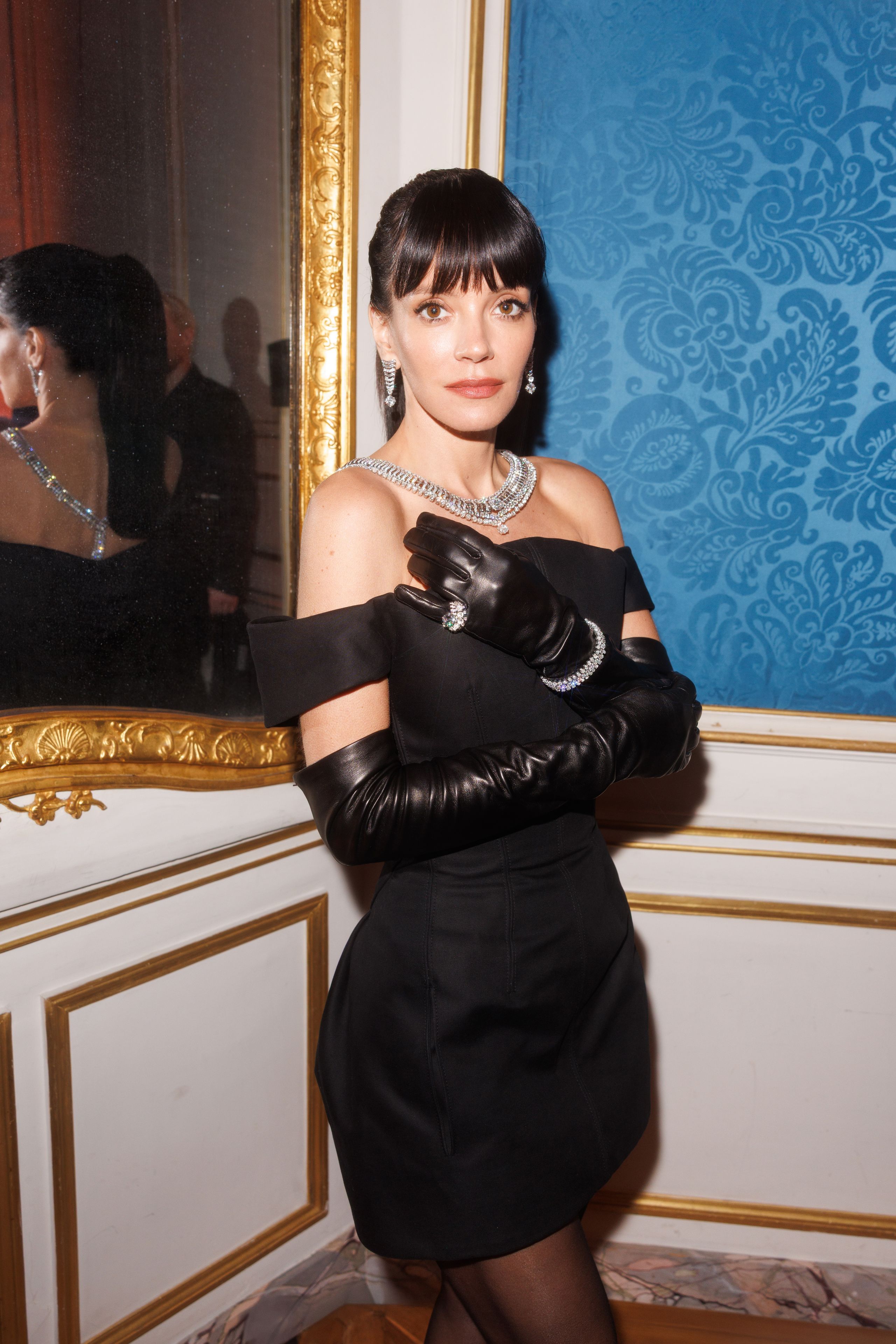 Image may contain Lily Allen Clothing Glove Person Adult Face Head Photography Portrait Dress and Accessories