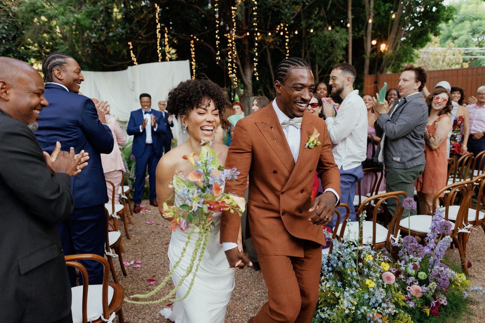 Image may contain: Weyes Blood, Wayne Shorter, Liliana Cavani, Adult, Person, Wedding, Blazer, Clothing, Coat, and Jacket